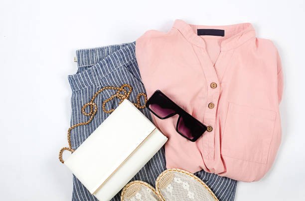 Set of seasonal summer fashion woman clothes, top view. Women's summer outfit. Second hand sustainable shopping; capsule minimal wardrobe; slow fashion idea; quality not quantity concept